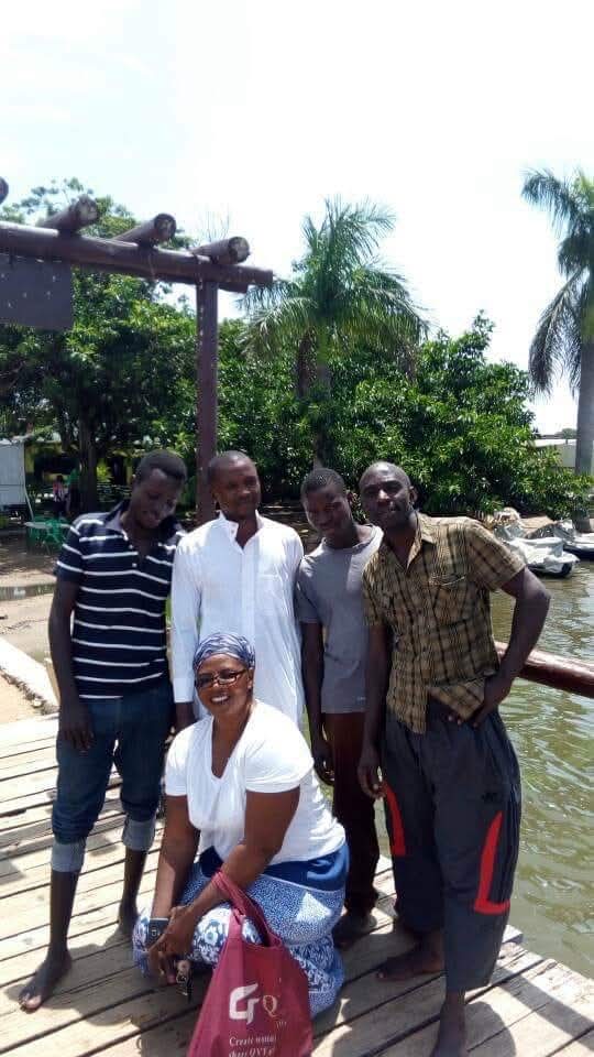 Church members together on a jetty by the water