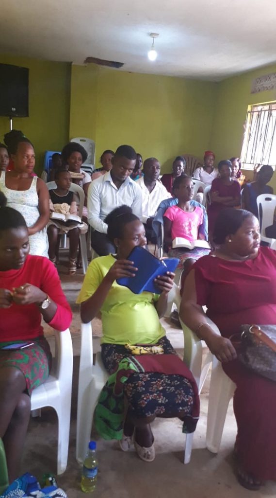 Members of the congregation studying the Word together during a service